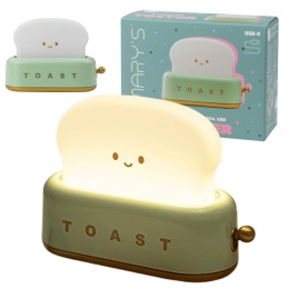 Zielony toster LED jako lampka nocna – włączona, świecąca na biurku